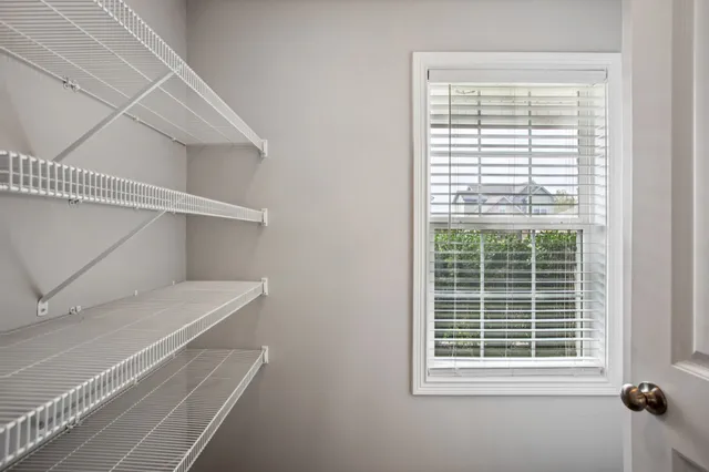 a view of a room that has a window in it