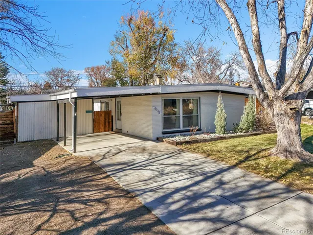 a house with trees in the background