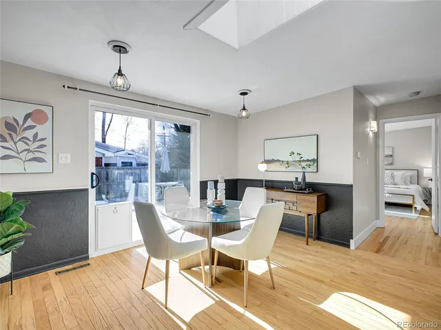 a view of a dining room with furniture window and outside view