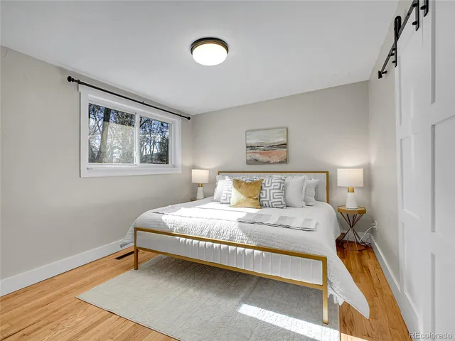 a bedroom with bed and a window