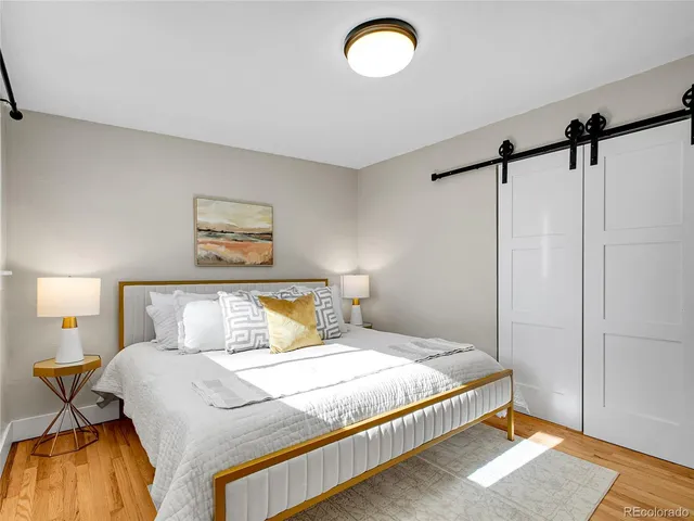 a bedroom with a bed and a table