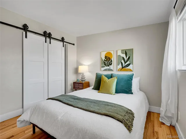 a bedroom with a bed and a table in it