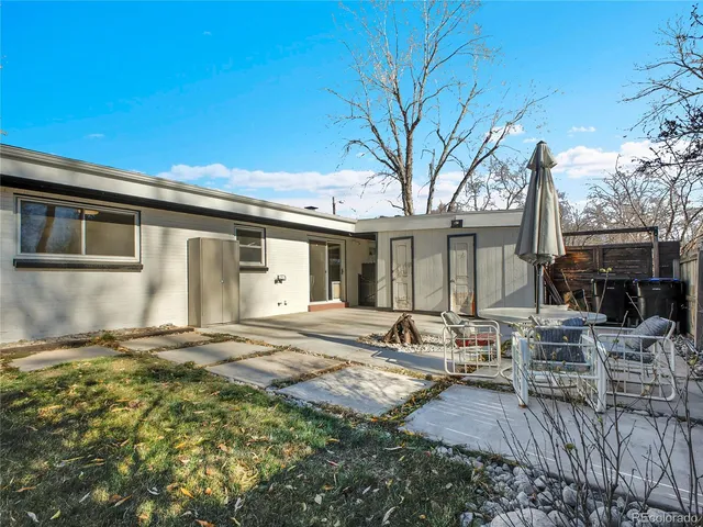 a house view with a sitting space and garden