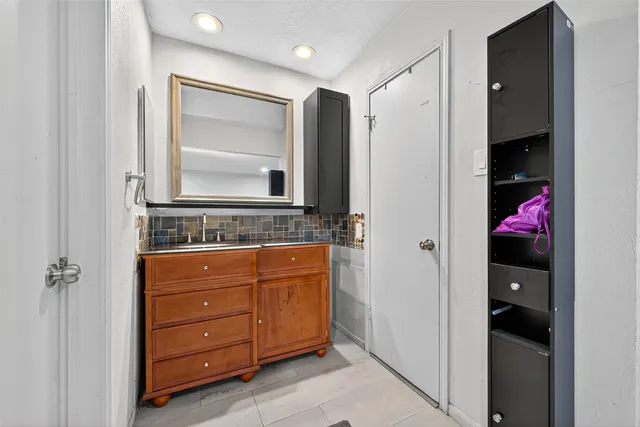a bathroom with a sink and a mirror