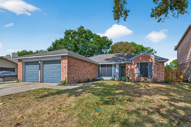 a view of a house with a yard and garage