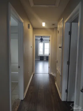 a bathroom with a toilet sink a mirror and shower