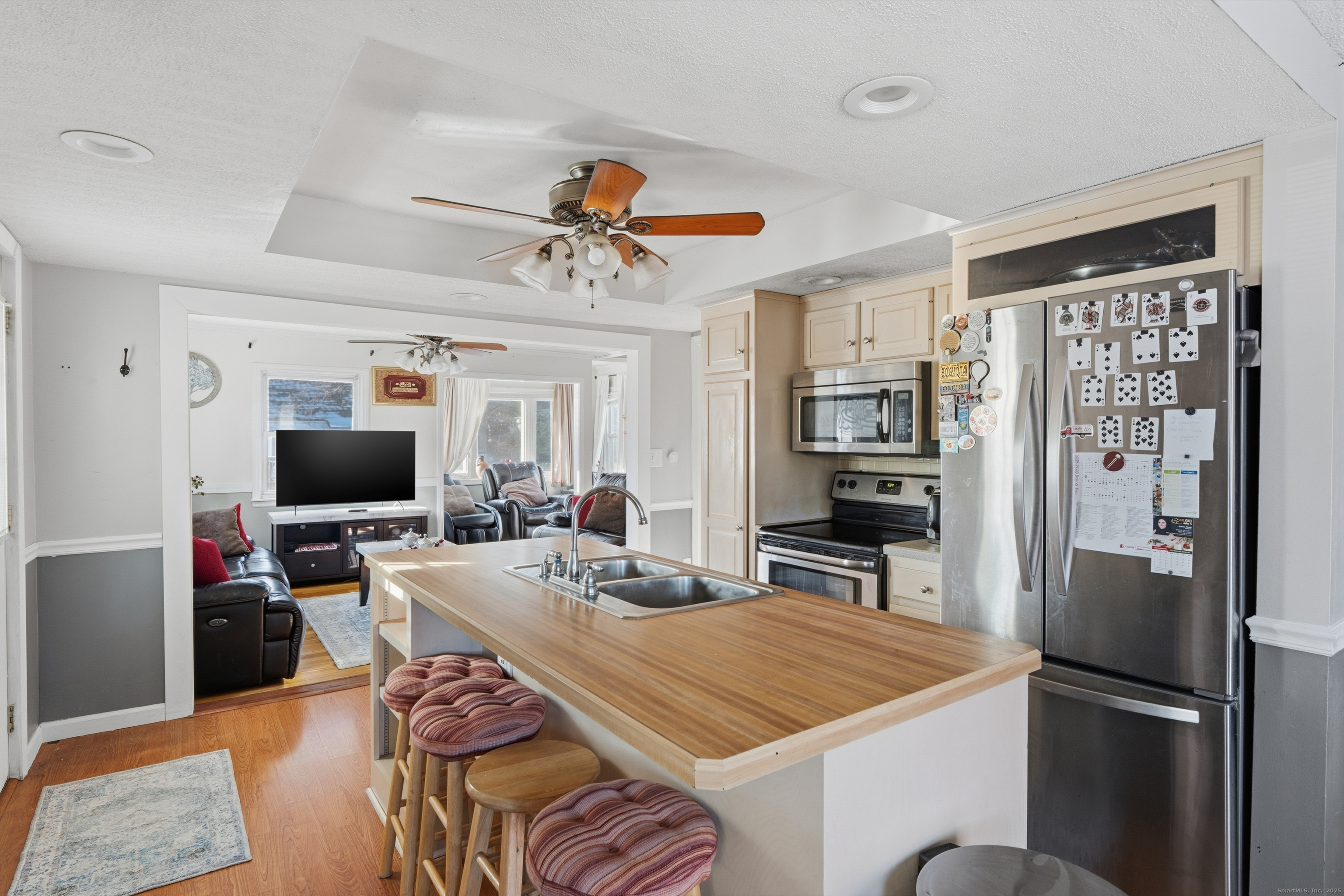103 Benham Street Bristol, CT 06010 - Photo 12 of 39 a living room with stainless steel appliances furniture and a fireplace