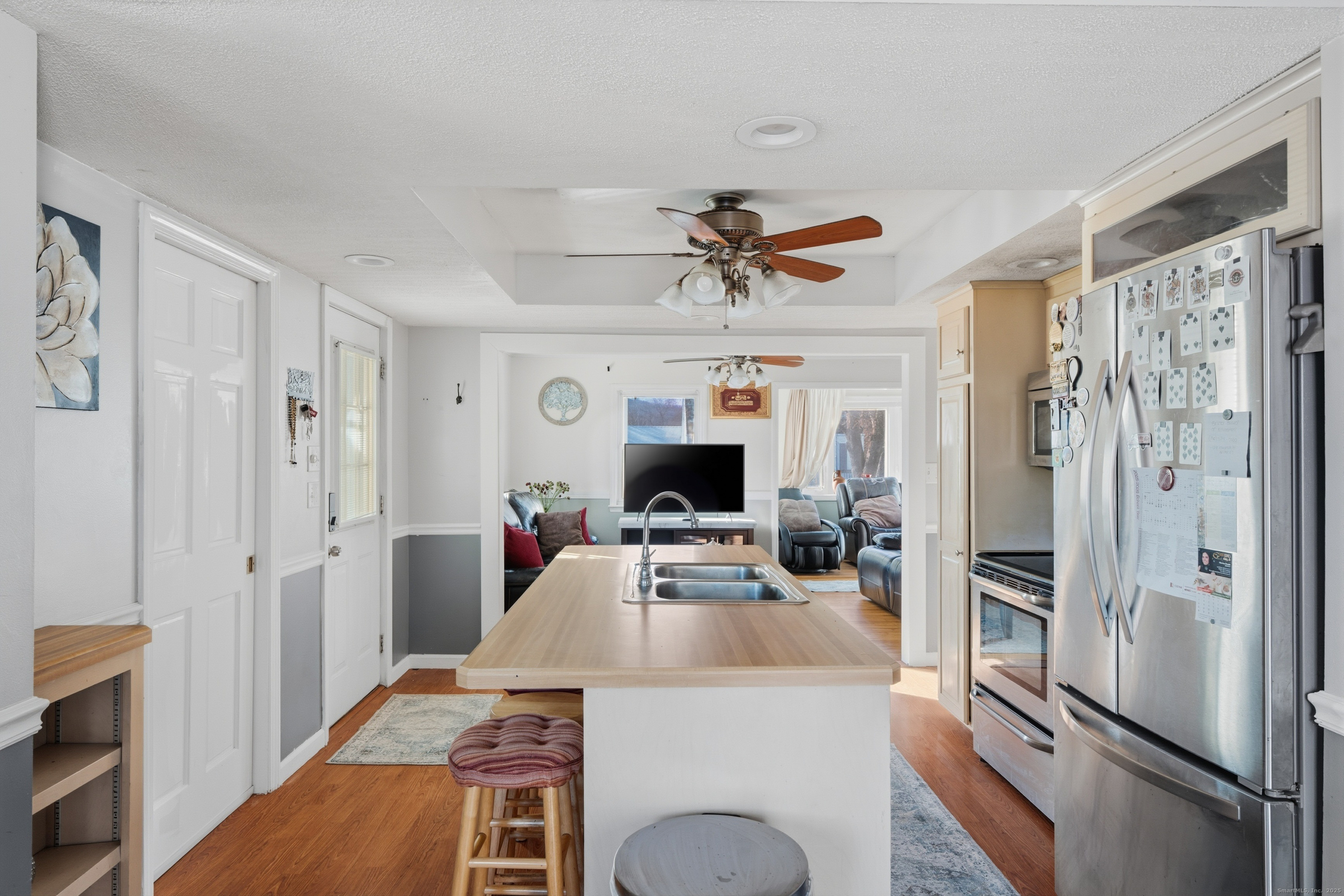 103 Benham Street Bristol, CT 06010 - Photo 13 of 39 a kitchen with a refrigerator a sink and cabinets
