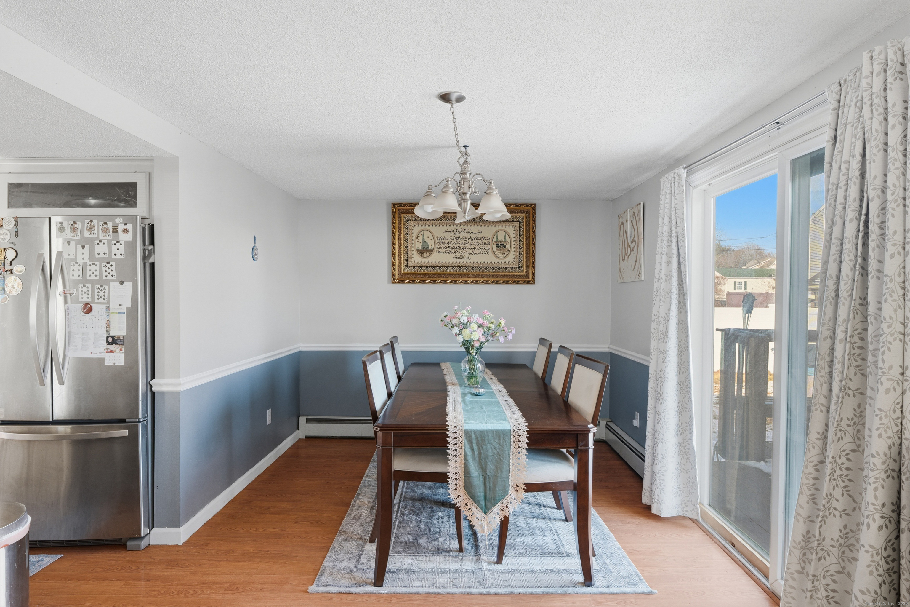 103 Benham Street Bristol, CT 06010 - Photo 14 of 39 a view of a dining room with furniture window and wooden floor