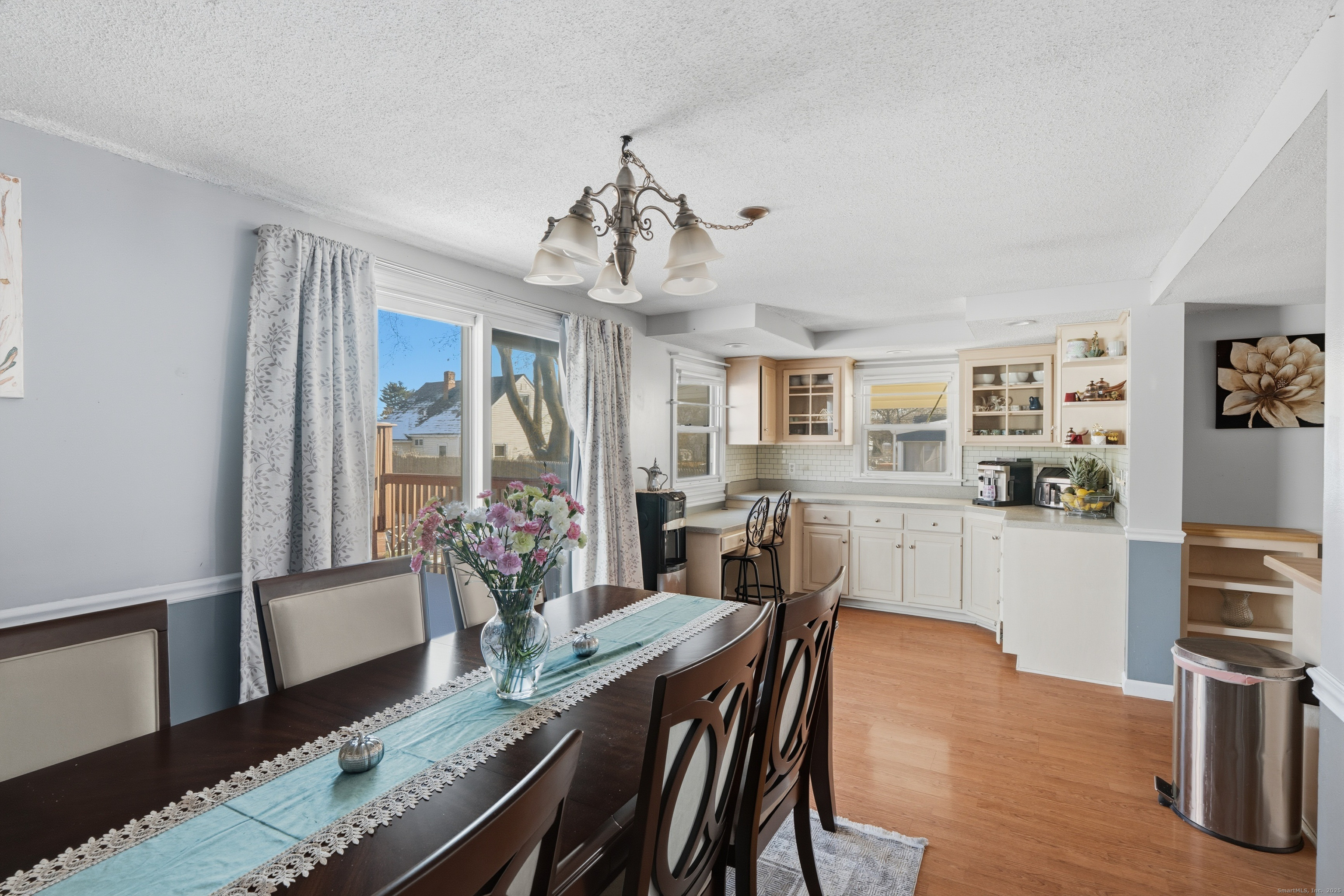 103 Benham Street Bristol, CT 06010 - Photo 15 of 39 a view of a dining room with furniture window and wooden floor