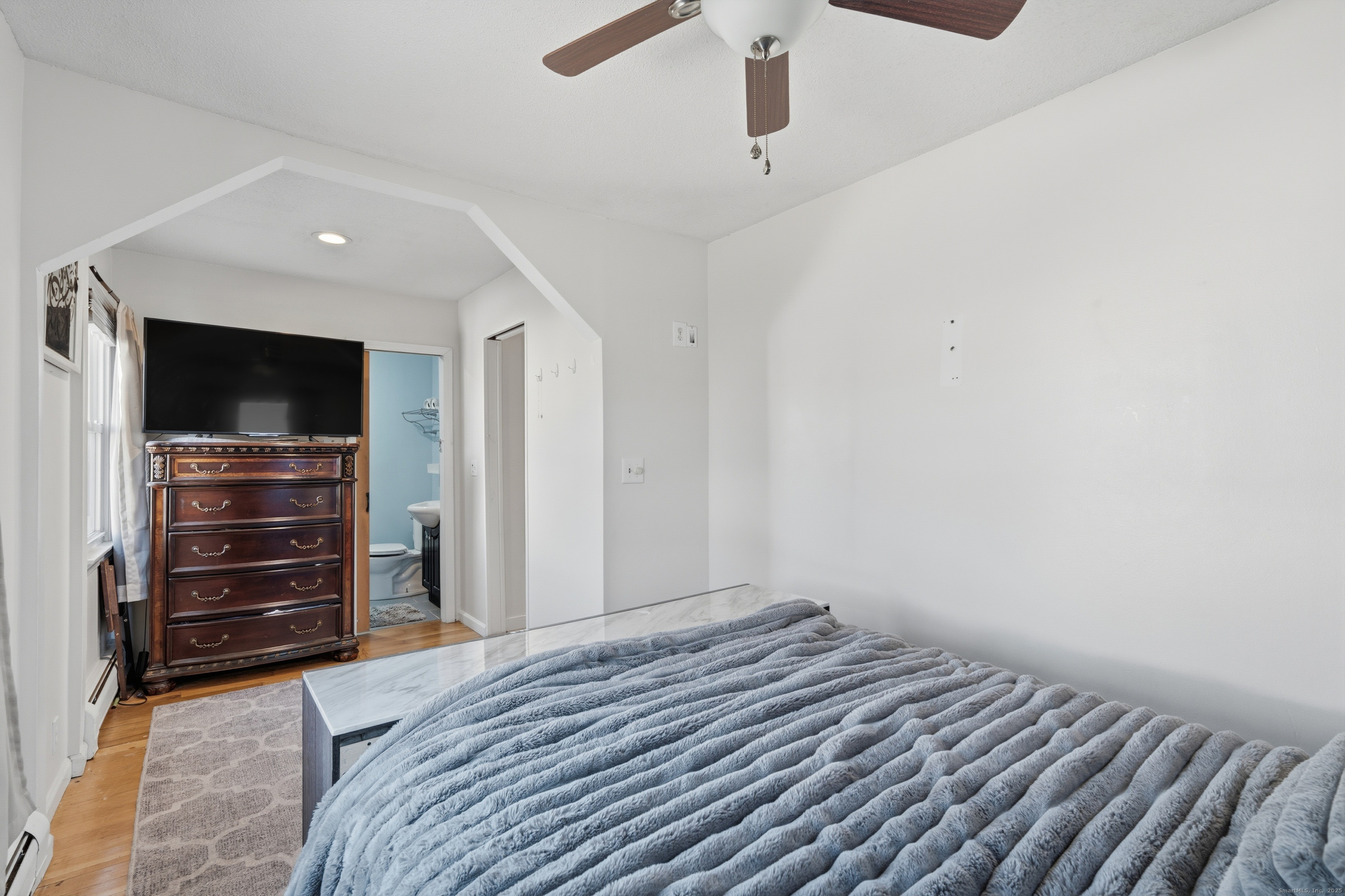 103 Benham Street Bristol, CT 06010 - Photo 19 of 39 a bedroom with a bed and a television