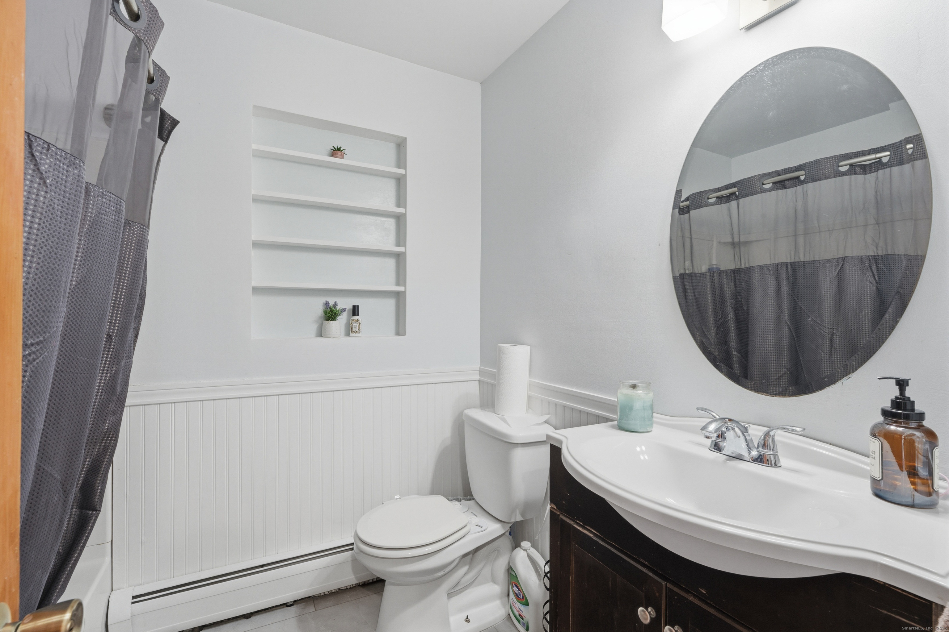 103 Benham Street Bristol, CT 06010 - Photo 22 of 39 a bathroom with a sink toilet and a mirror