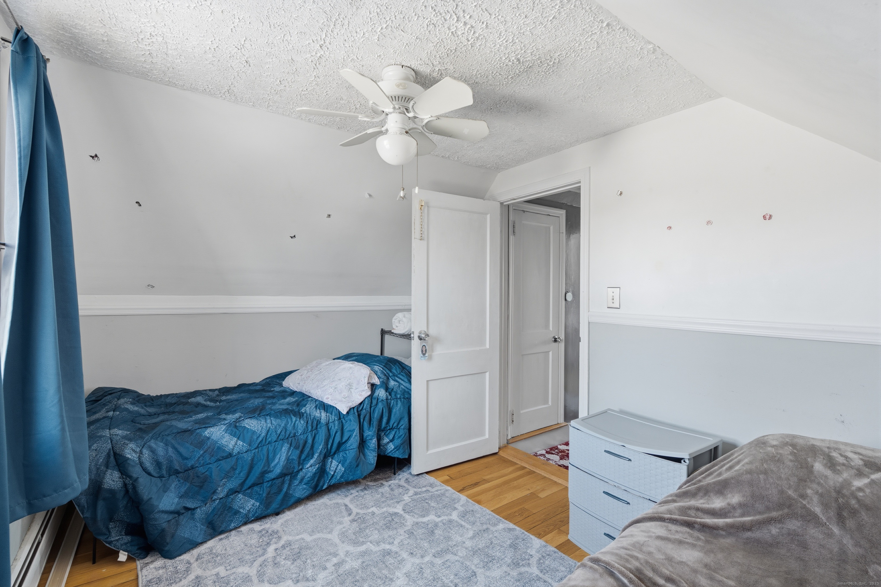 103 Benham Street Bristol, CT 06010 - Photo 24 of 39 a bedroom with a bed and a chandelier