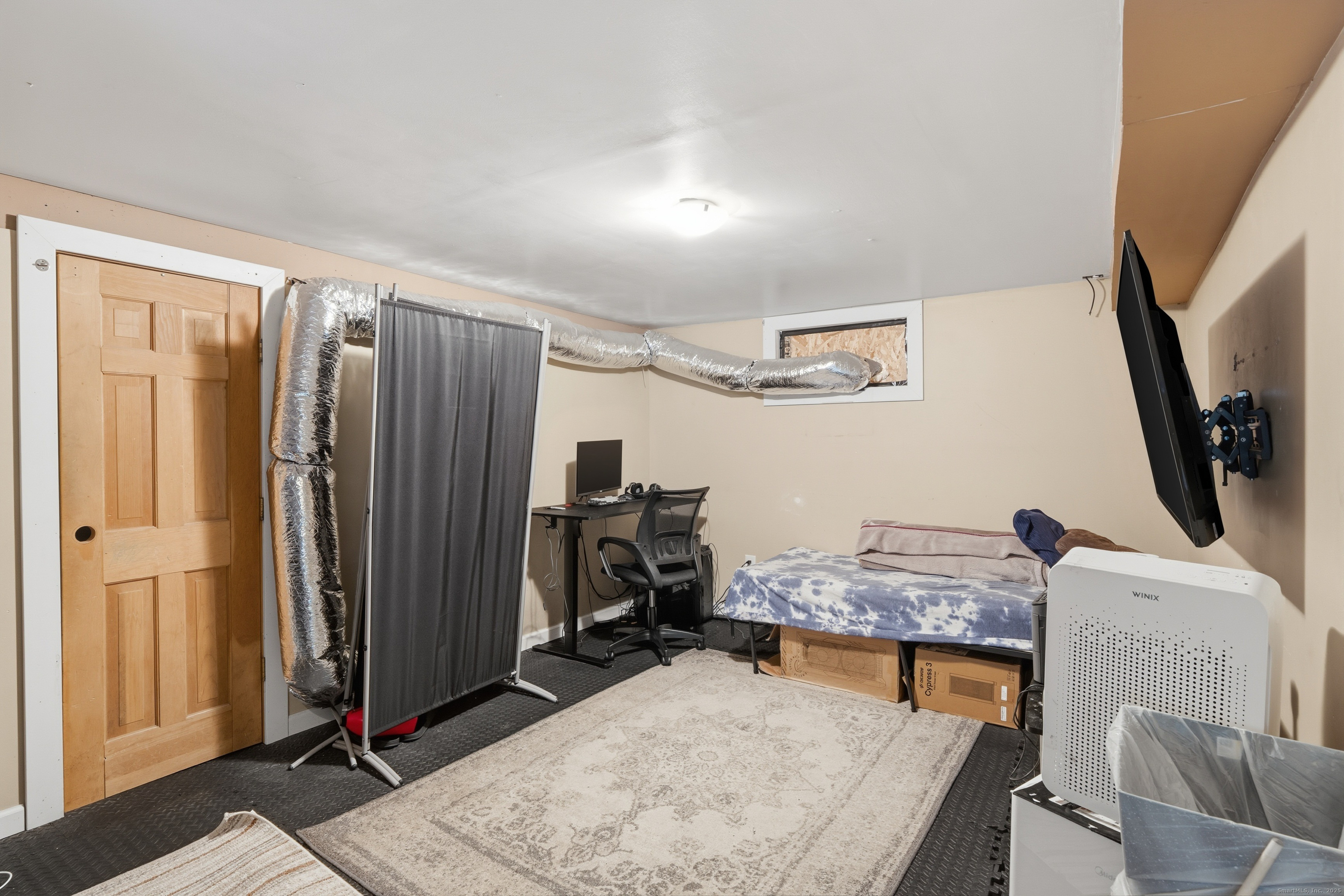 103 Benham Street Bristol, CT 06010 - Photo 27 of 39 a room with furniture and a flat screen tv