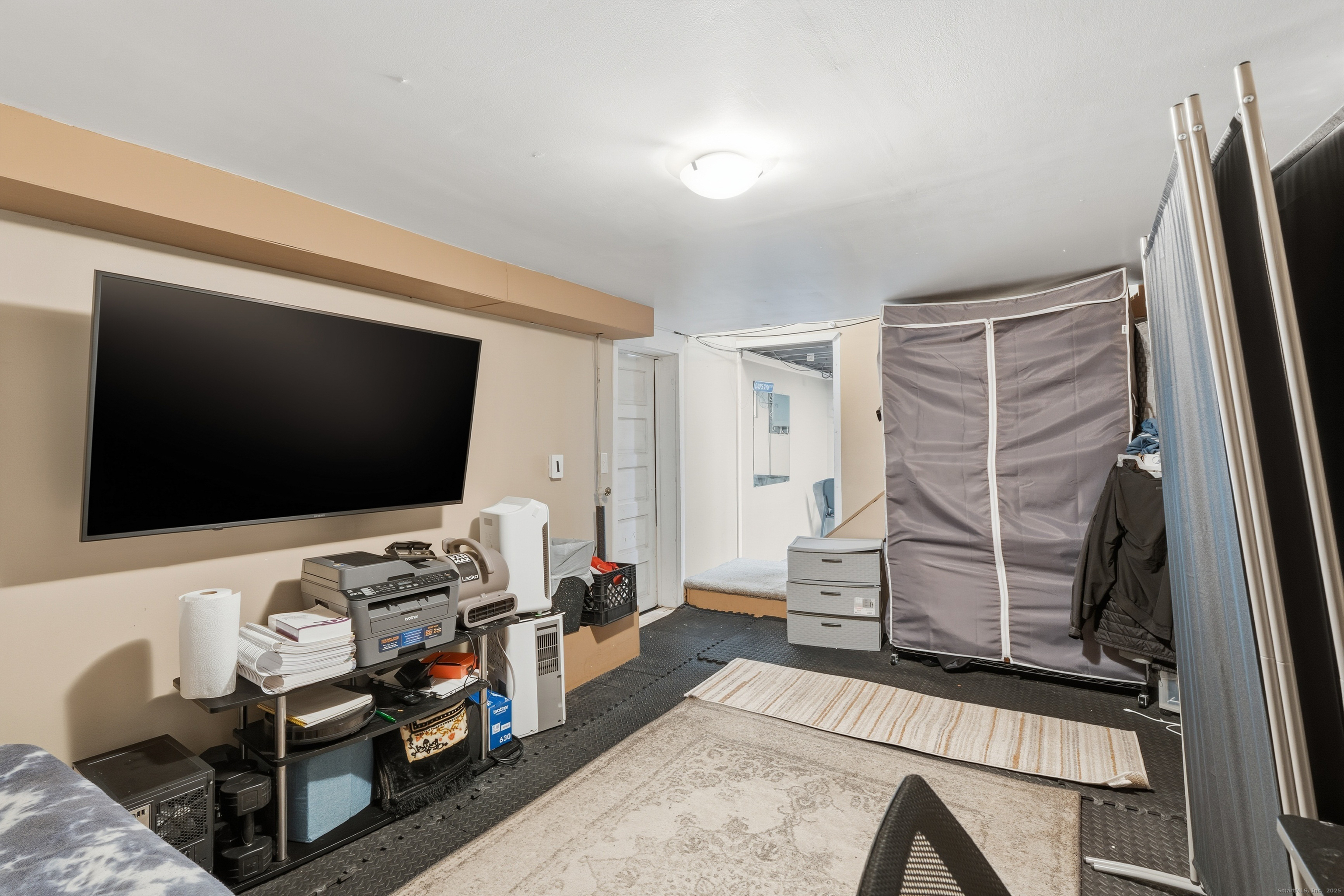 103 Benham Street Bristol, CT 06010 - Photo 28 of 39 a living room with furniture and a flat screen tv