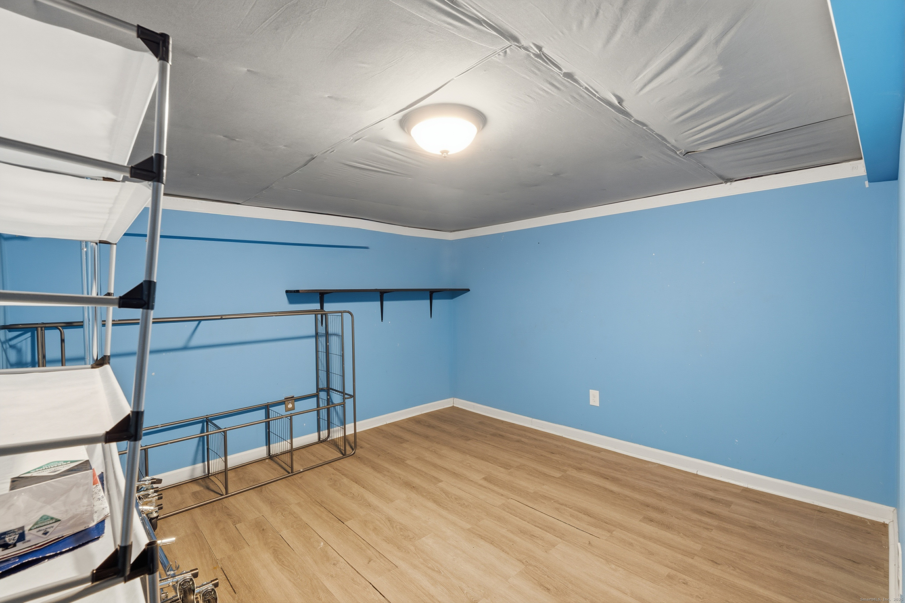 103 Benham Street Bristol, CT 06010 - Photo 29 of 39 a view of empty room with wooden floor