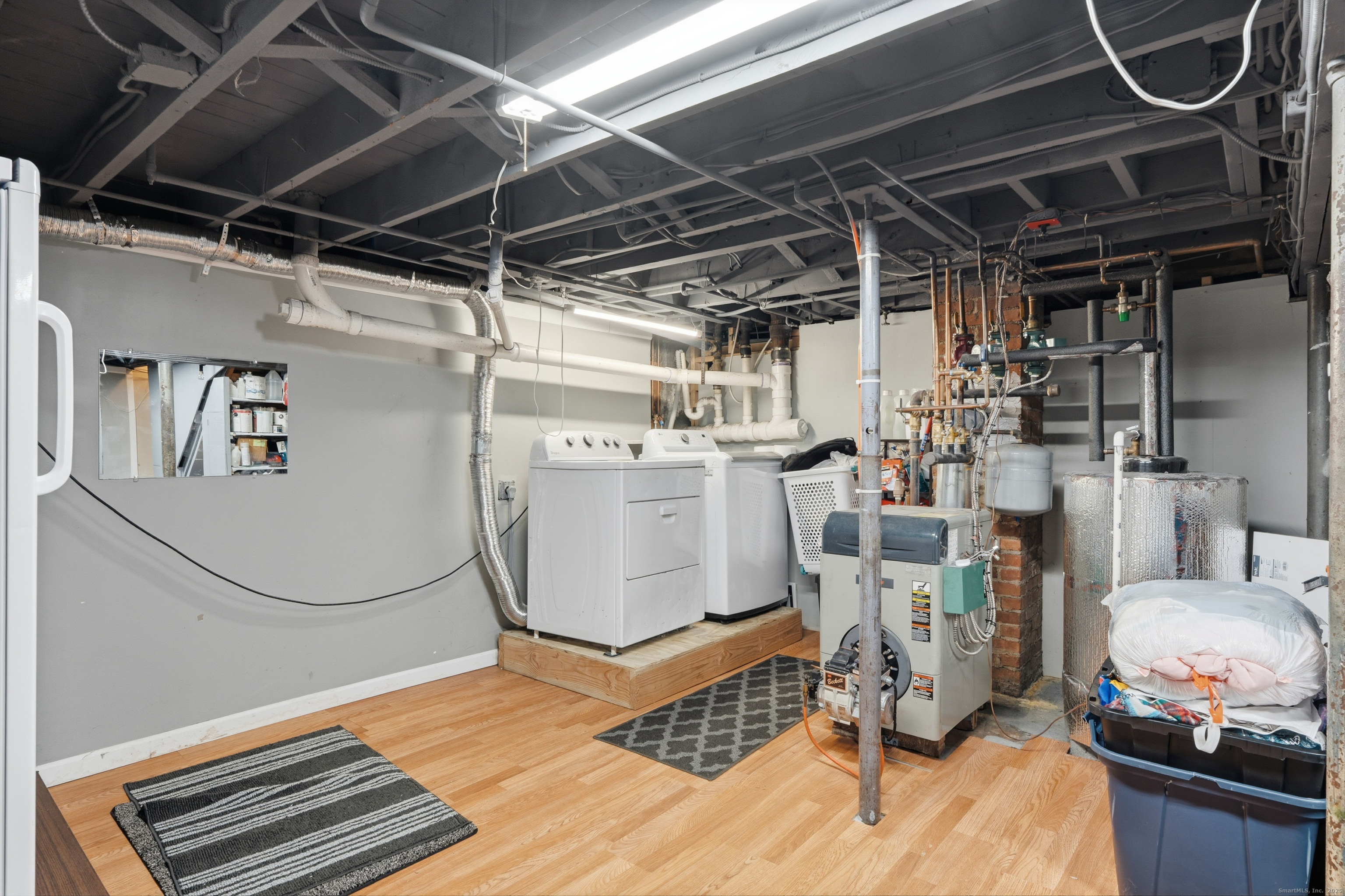 103 Benham Street Bristol, CT 06010 - Photo 32 of 39 a storage room with washer and dryer
