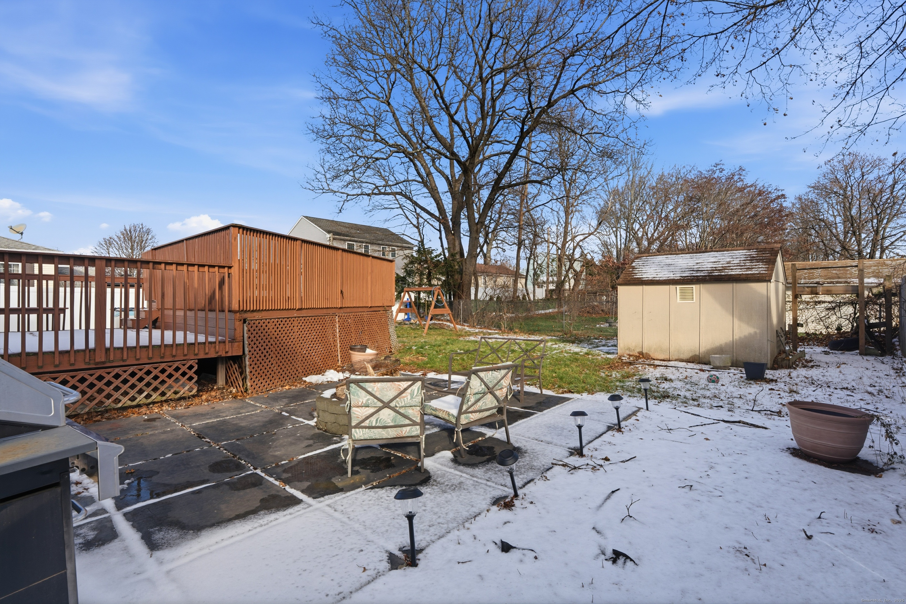 103 Benham Street Bristol, CT 06010 - Photo 34 of 39 a backyard of a house with table and chairs