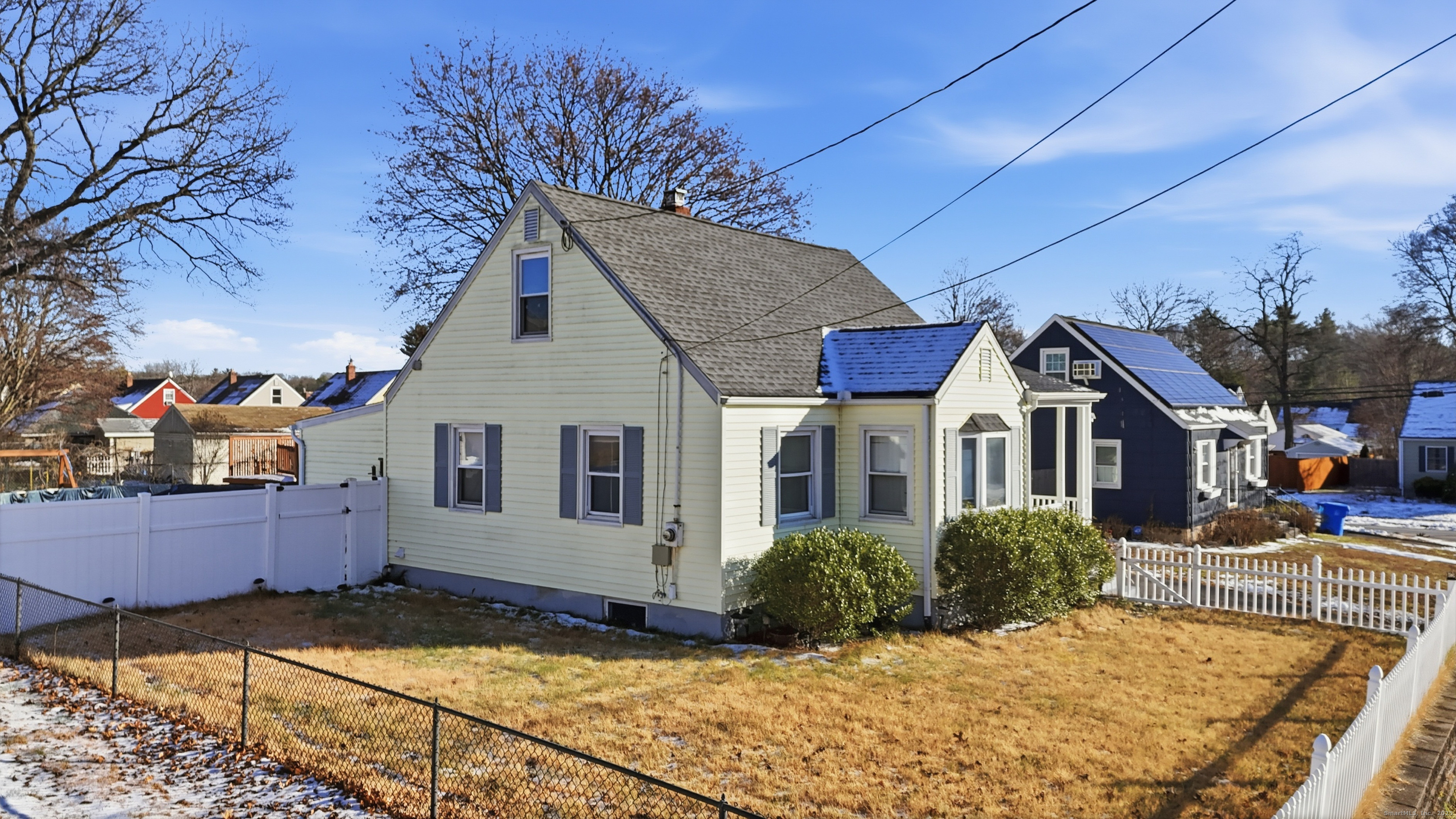 103 Benham Street Bristol, CT 06010 - Photo 4 of 39 a view of a house with snow on the wall