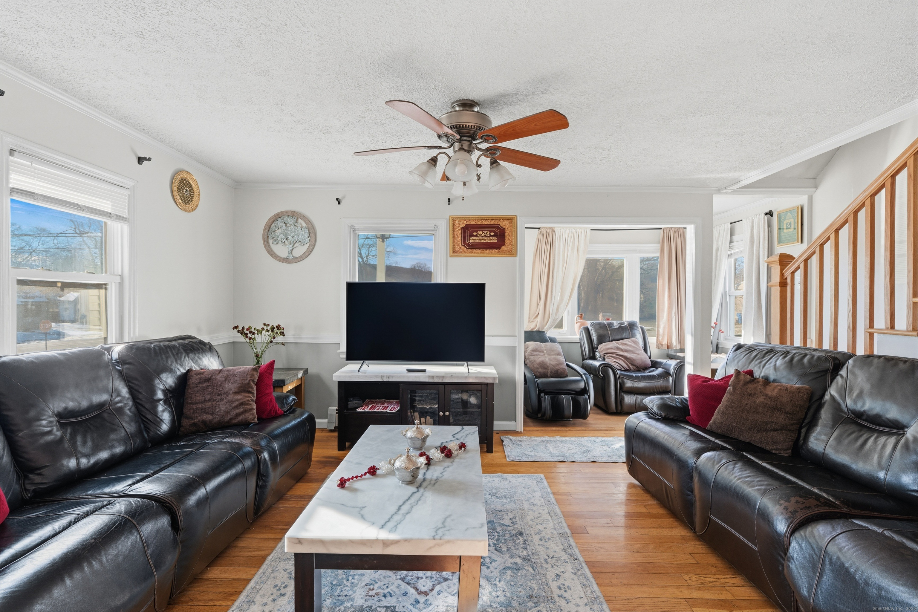 103 Benham Street Bristol, CT 06010 - Photo 7 of 39 a living room with furniture and a flat screen tv