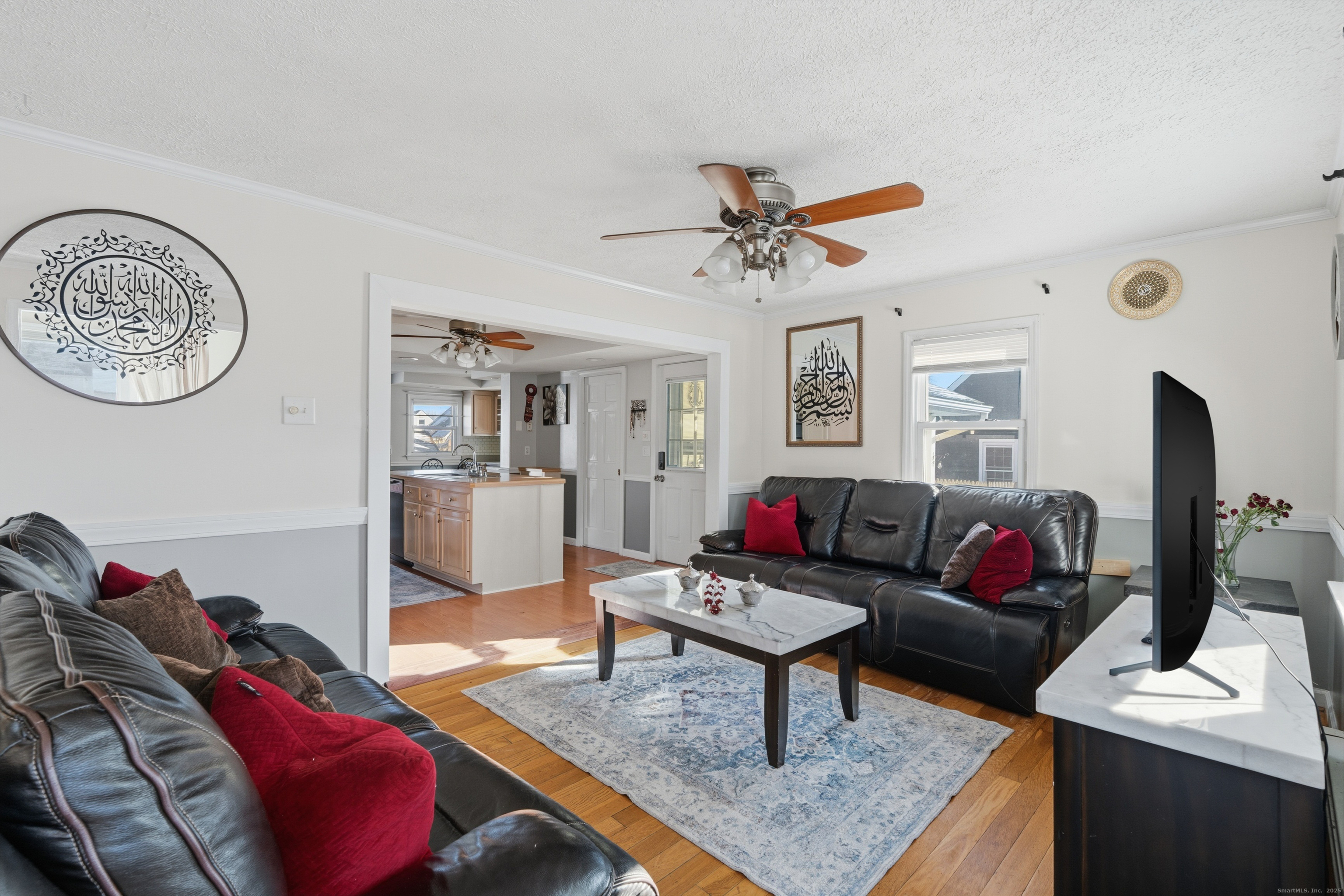 103 Benham Street Bristol, CT 06010 - Photo 8 of 39 a living room with furniture and wooden floor