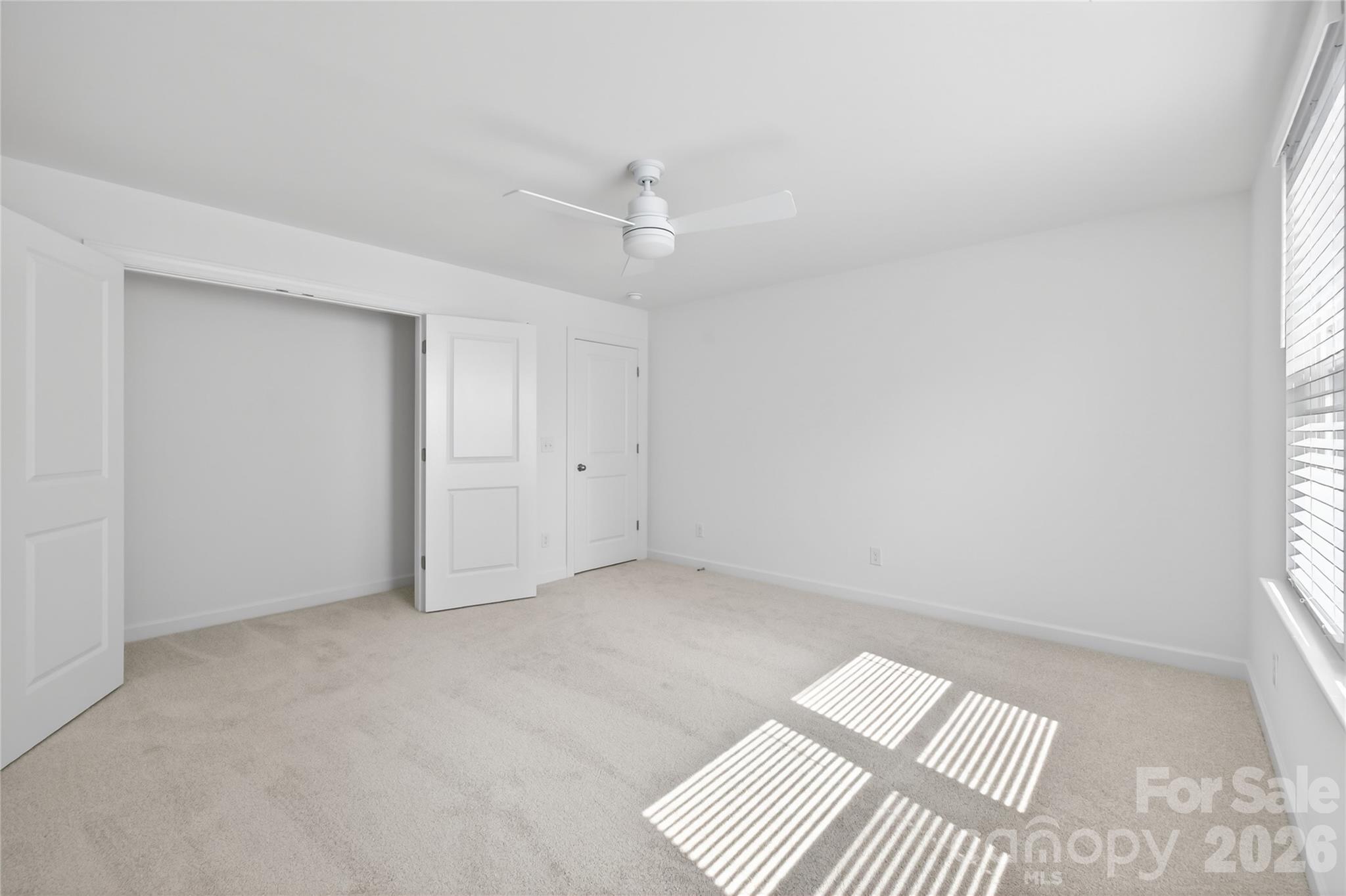 128 Overcash Road, Unit 7171 Troutman, NC 28166 - Photo 30 of 41 wooden floor in an empty room with a window