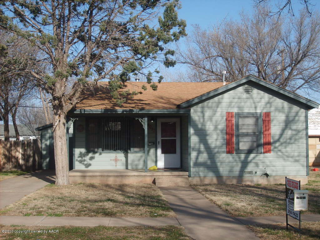 4011 South Jackson Street Amarillo, TX 79110 - Photo 1 of 10 a view of a house with a tree on the road