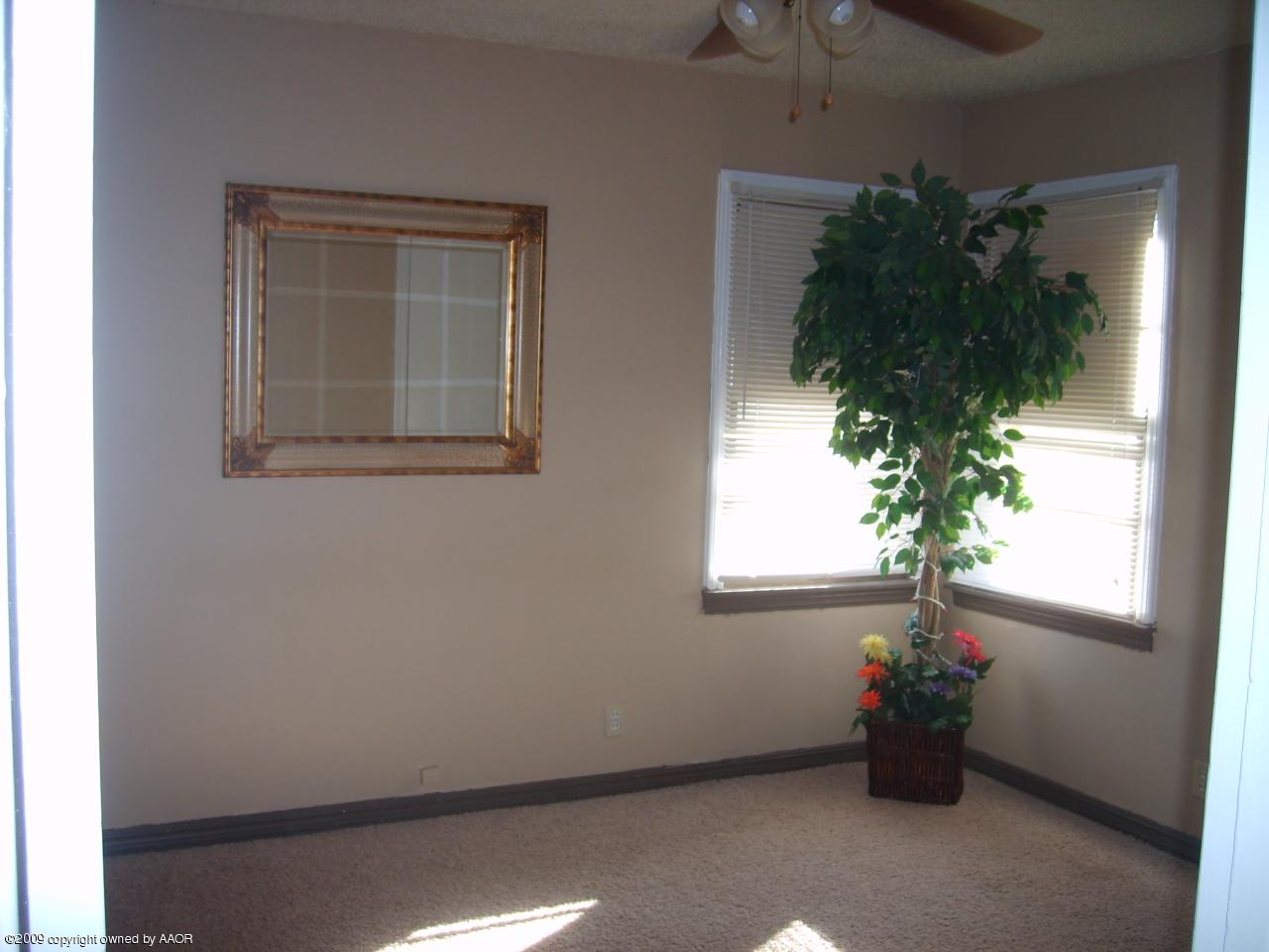4011 South Jackson Street Amarillo, TX 79110 - Photo 5 of 10 a view of a house with a flower garden