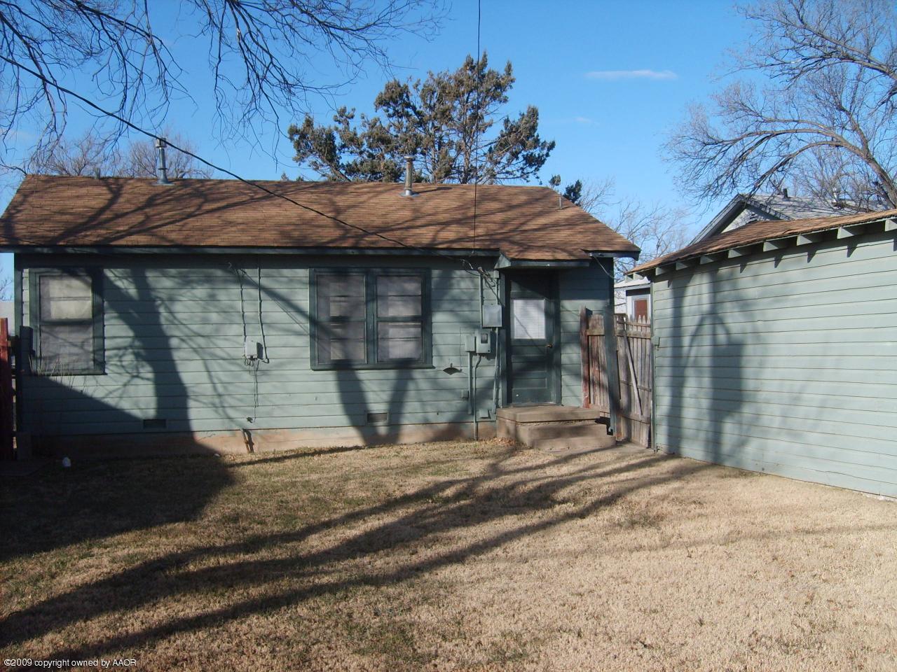 4011 South Jackson Street Amarillo, TX 79110 - Photo 6 of 10 a backyard of a house with barbeque oven table and chairs