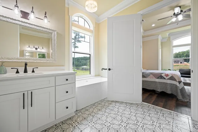 a bathroom with a double vanity sink mirror and shower