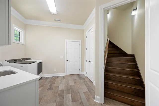 a view of a livingroom with furniture and wooden floor