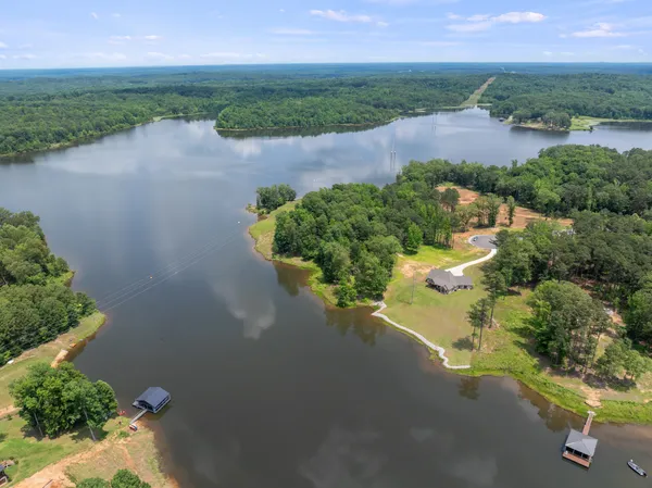 a view of a lake with a yard