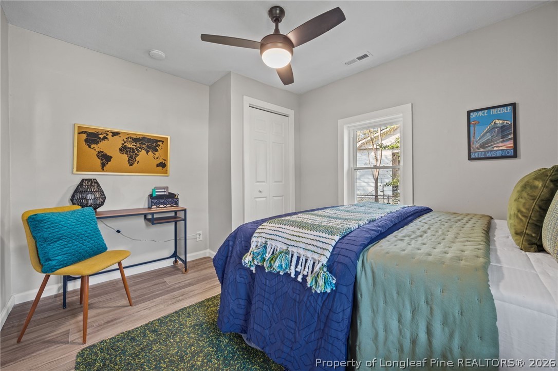 625 Eva Circle Spring Lake, NC 28390 - Photo 5 of 28 a bedroom that has a bed and a chair in it