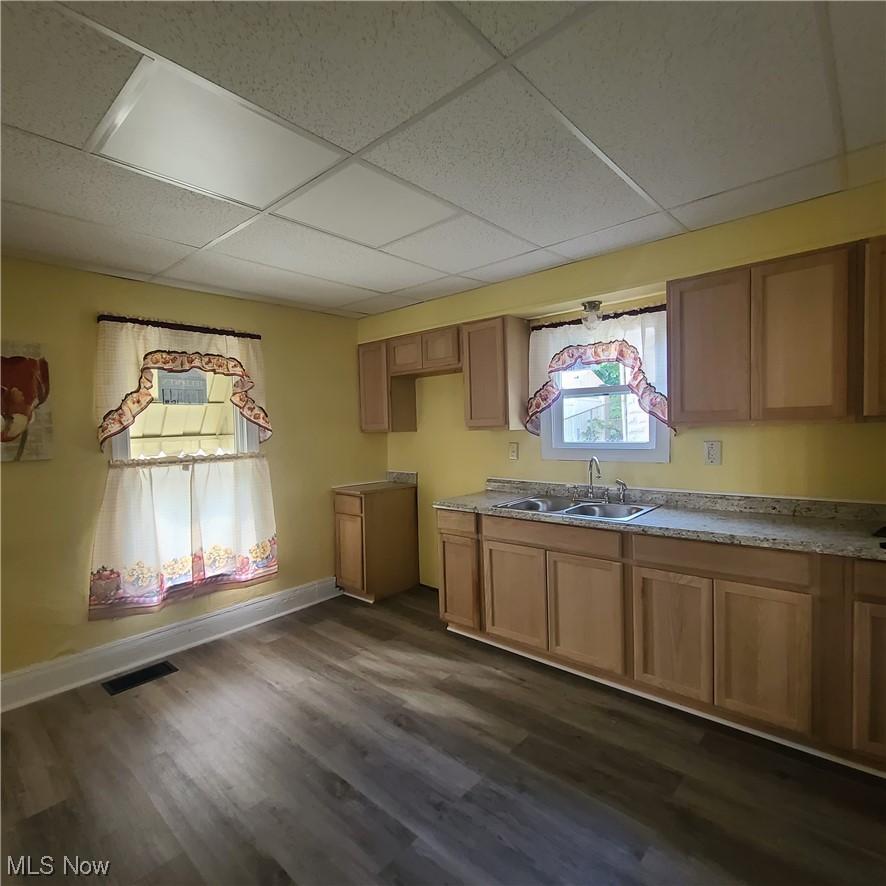 854 National Road Bridgeport, OH 43912 - Photo 13 of 27 Kitchen with a drop ceiling, laminate floors, and brown cabinets