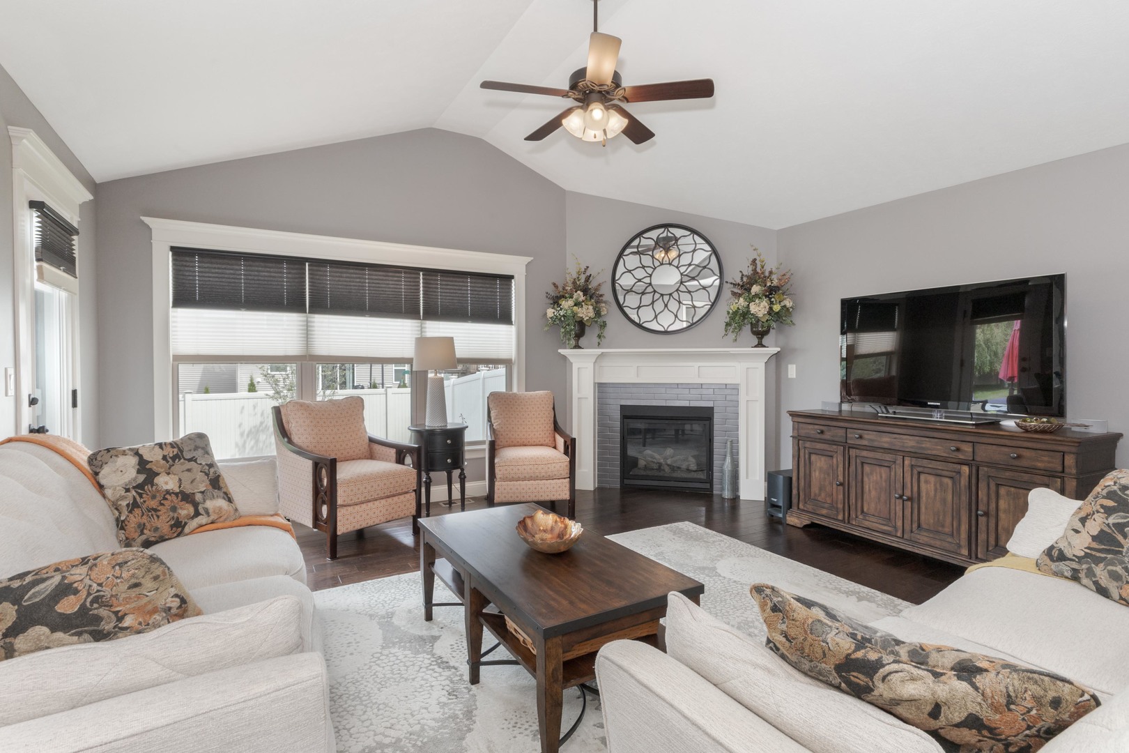 2610 Shepard Road Normal, IL 61761 - Photo 11 of 46 a living room with furniture a flat screen tv and a fireplace