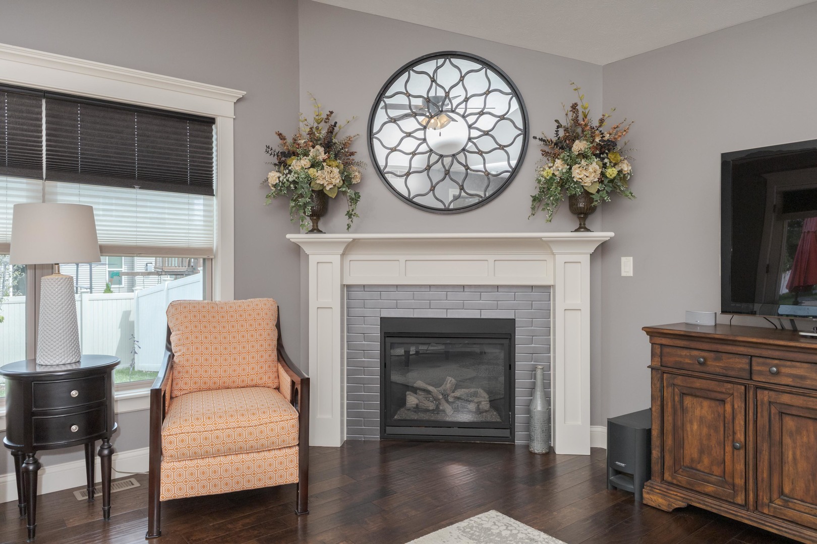 2610 Shepard Road Normal, IL 61761 - Photo 15 of 46 a living room with furniture a clock and a fireplace