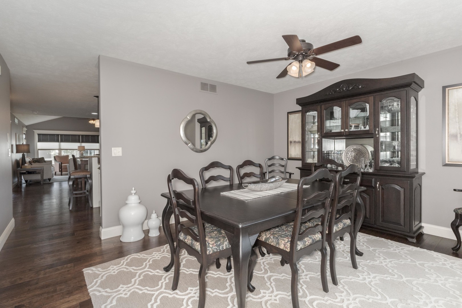 2610 Shepard Road Normal, IL 61761 - Photo 18 of 46 a view of a dining room and livingroom with furniture wooden floor a rug a painting and a chandelier
