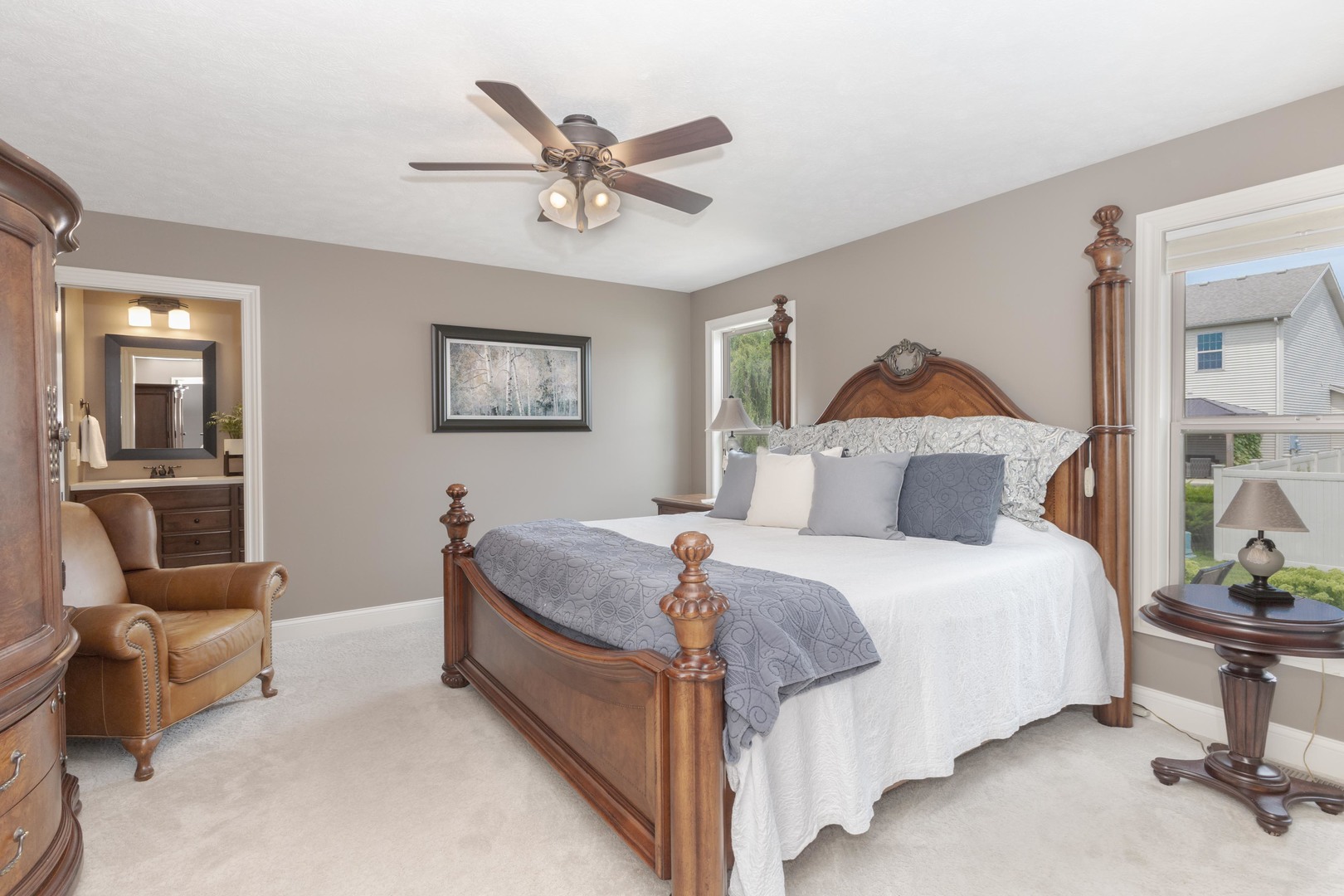 2610 Shepard Road Normal, IL 61761 - Photo 19 of 46 a bedroom with a bed and a chandelier