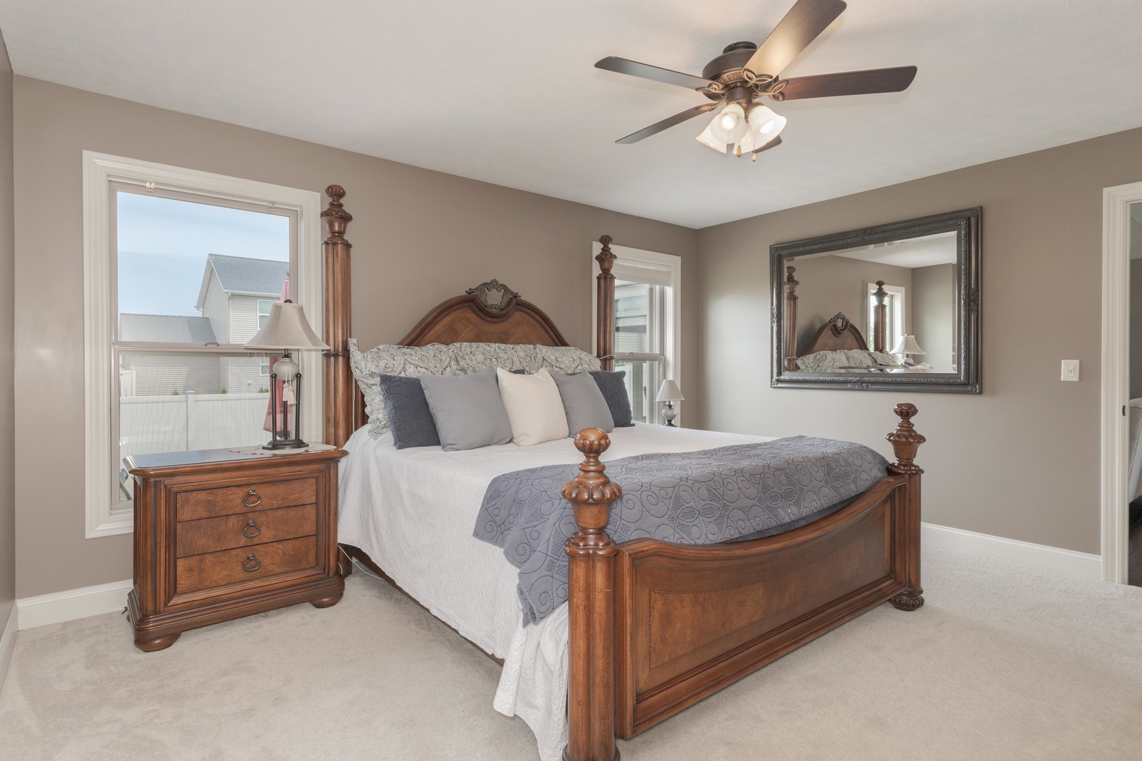 2610 Shepard Road Normal, IL 61761 - Photo 20 of 46 a spacious bedroom with a bed and a chandelier