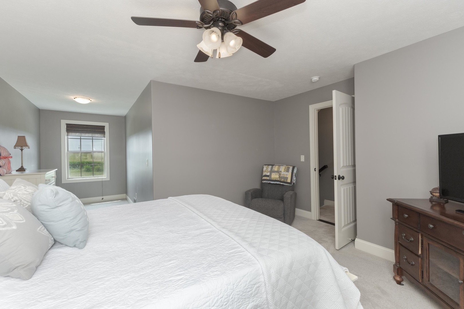 2610 Shepard Road Normal, IL 61761 - Photo 26 of 46 a bedroom with a bed and a flat tv screen on dresser