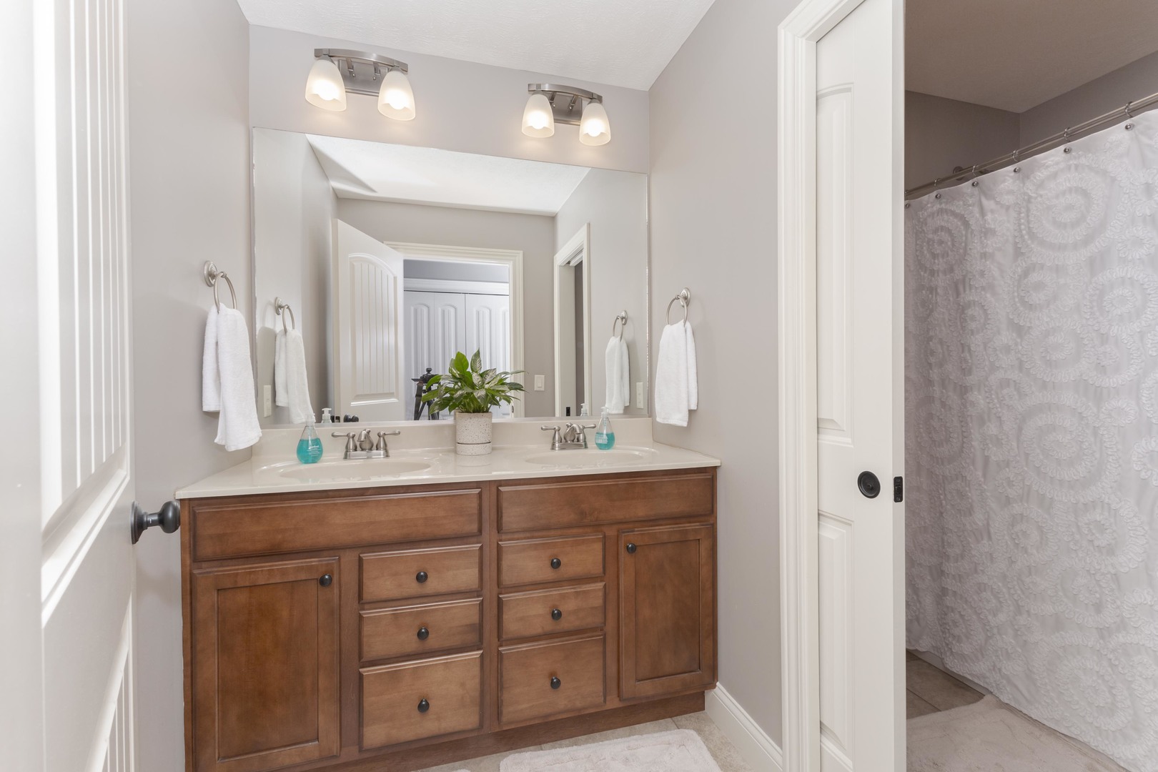 2610 Shepard Road Normal, IL 61761 - Photo 28 of 46 a bathroom with a double vanity sink and a mirror