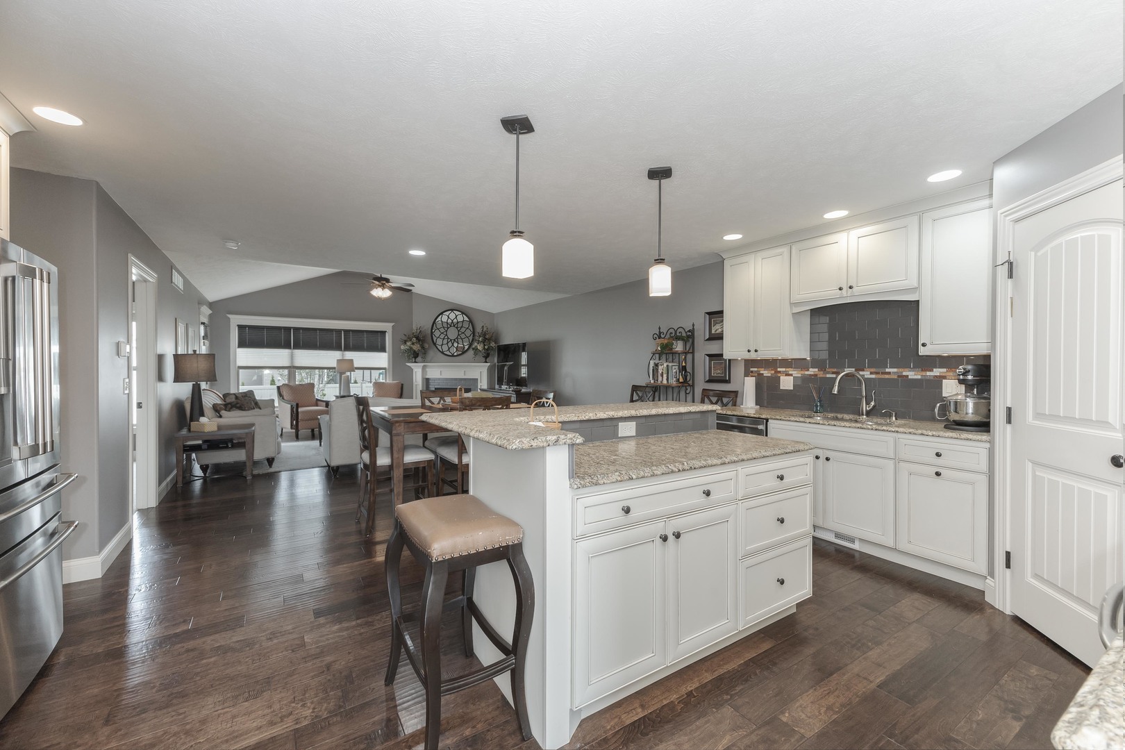 2610 Shepard Road Normal, IL 61761 - Photo 3 of 46 a kitchen with lots of counter space dining table and chairs