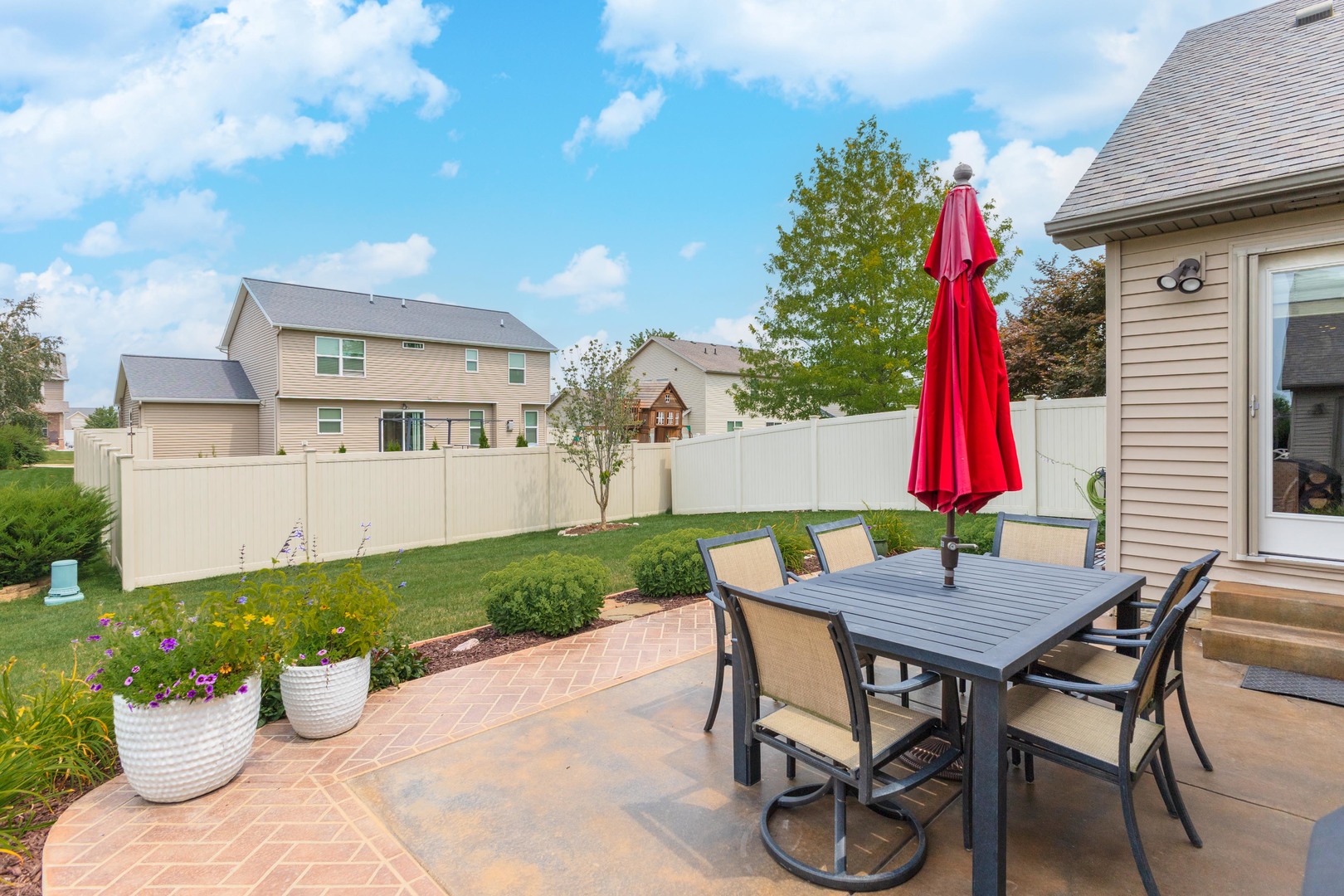 2610 Shepard Road Normal, IL 61761 - Photo 41 of 46 a view of a patio with table and chairs and potted plants
