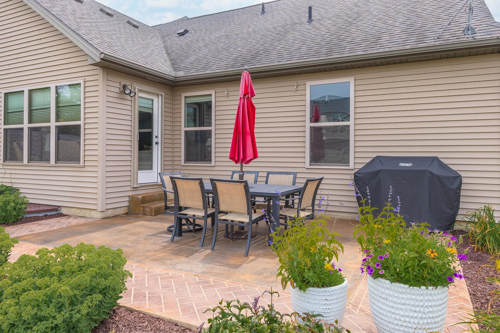 2610 Shepard Road Normal, IL 61761 - Photo 43 of 46 a view of a patio with table and chairs and potted plants