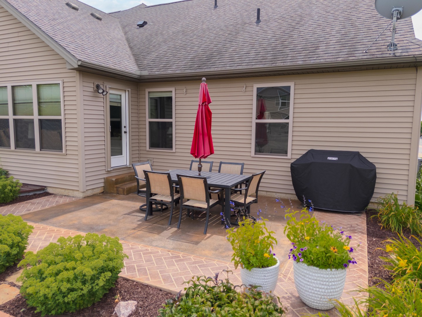 2610 Shepard Road Normal, IL 61761 - Photo 45 of 46 a view of a backyard with table and chairs potted plants