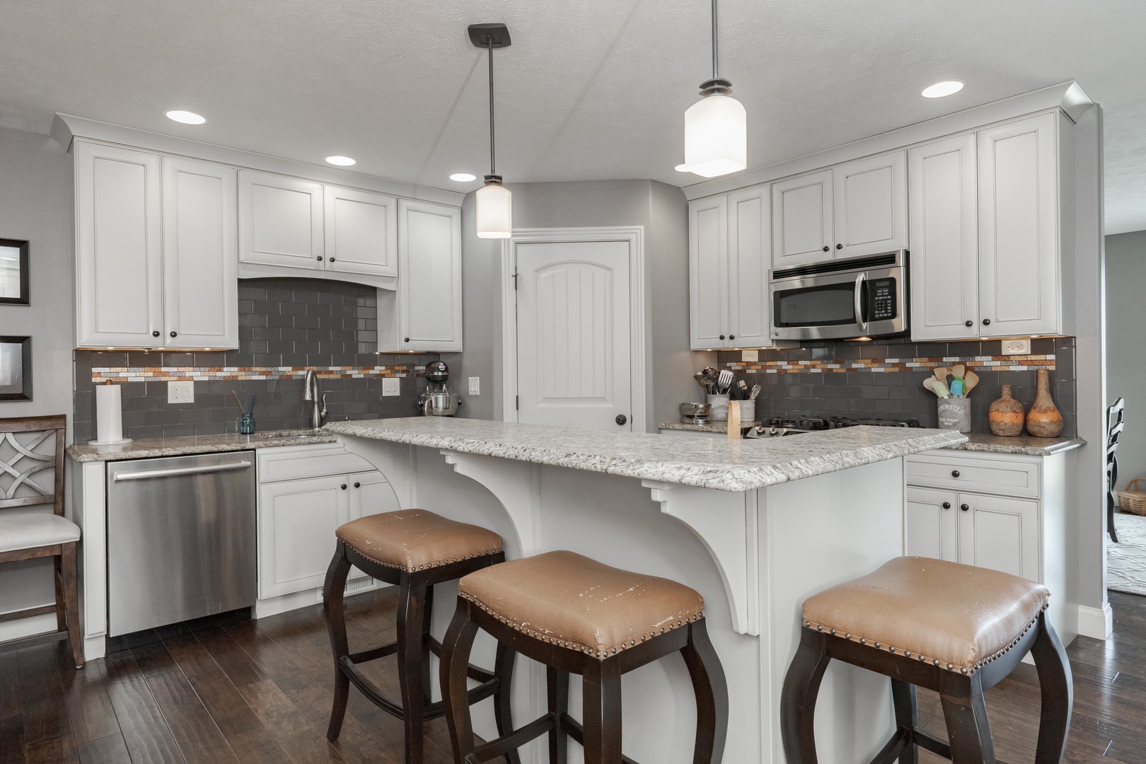 2610 Shepard Road Normal, IL 61761 - Photo 5 of 46 a kitchen with kitchen island granite countertop a table and chairs in it