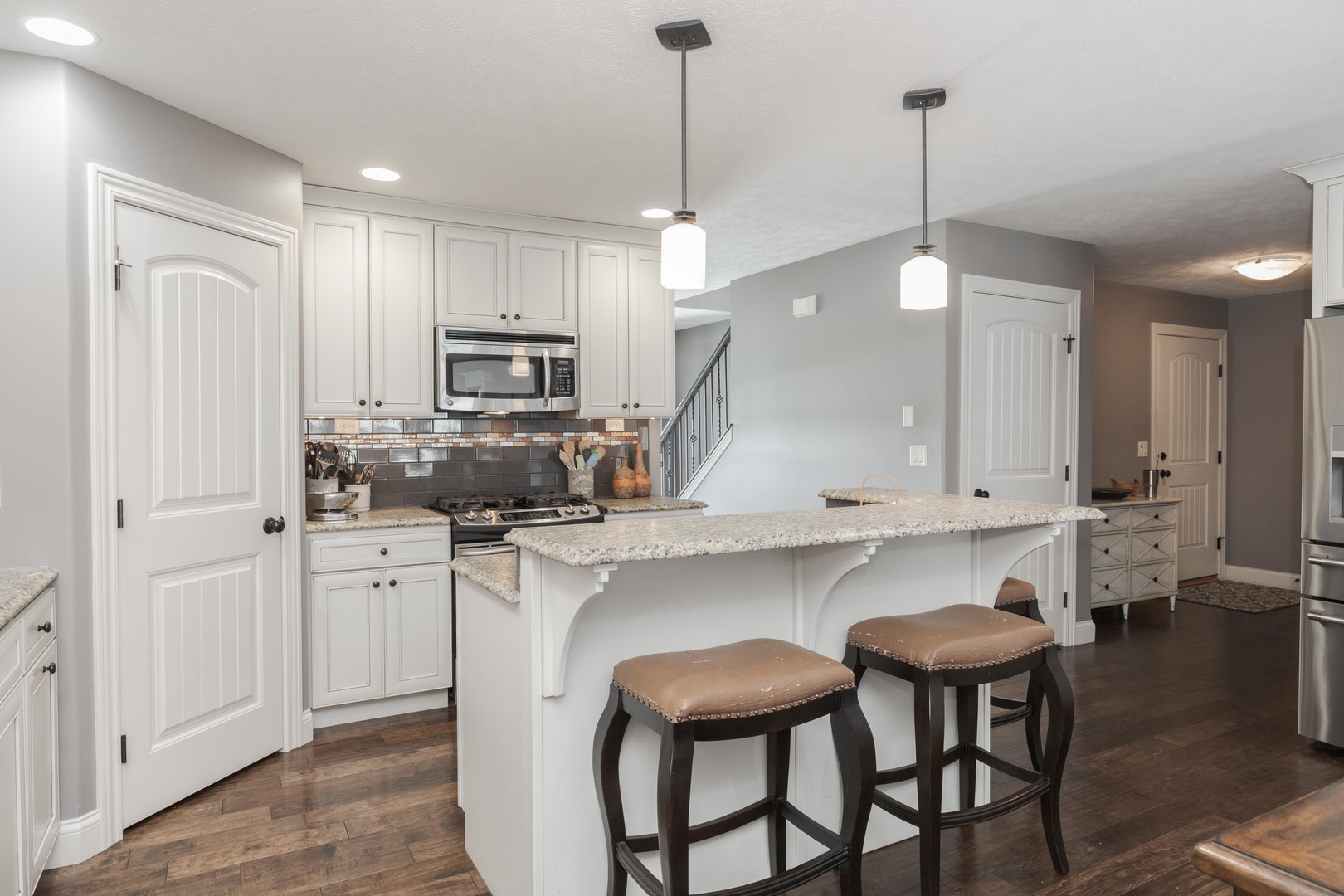 2610 Shepard Road Normal, IL 61761 - Photo 8 of 46 a kitchen with white cabinets and stainless steel appliances