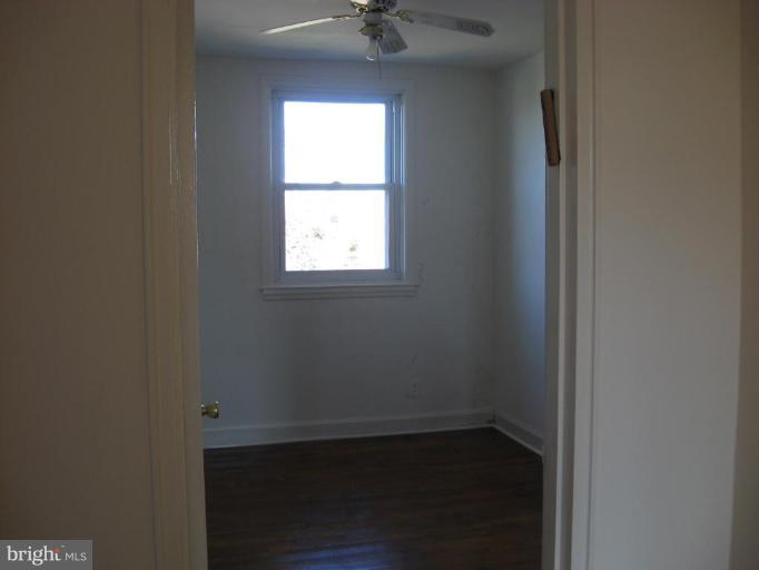 6923 Fieldcrest Road Baltimore, MD 21215 - Photo 8 of 10 an empty room with a window