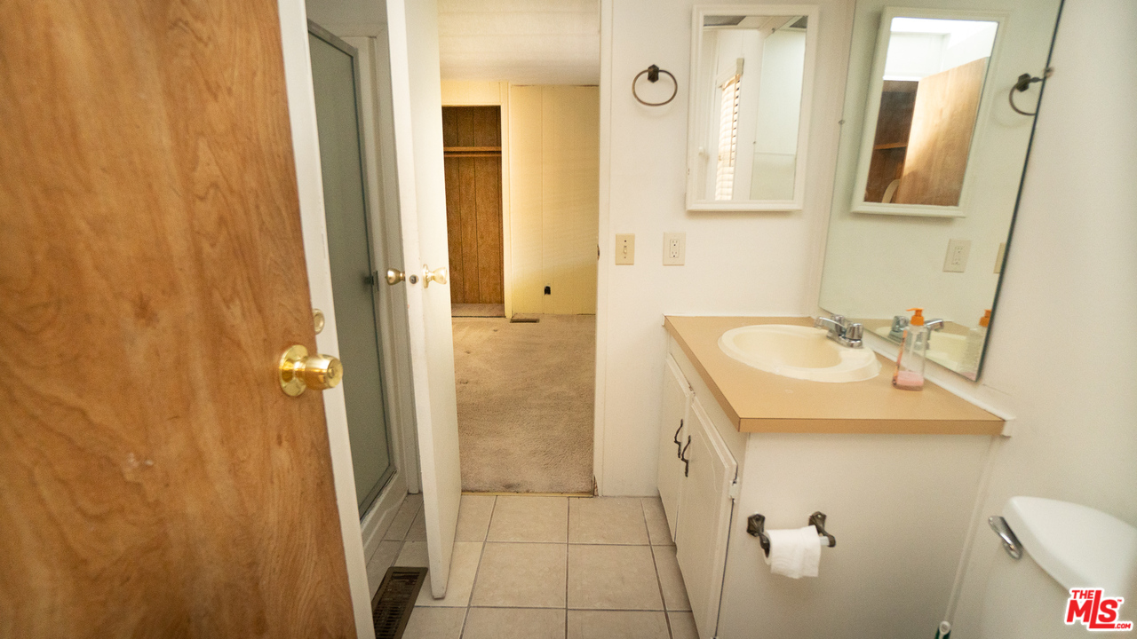 17701 South Avalon Boulevard, Unit 147 Carson, CA 90746 - Photo 17 of 28 a bathroom with a sink and a mirror