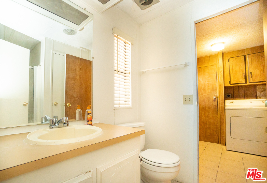 17701 South Avalon Boulevard, Unit 147 Carson, CA 90746 - Photo 19 of 28 a bathroom with a sink a toilet and shower